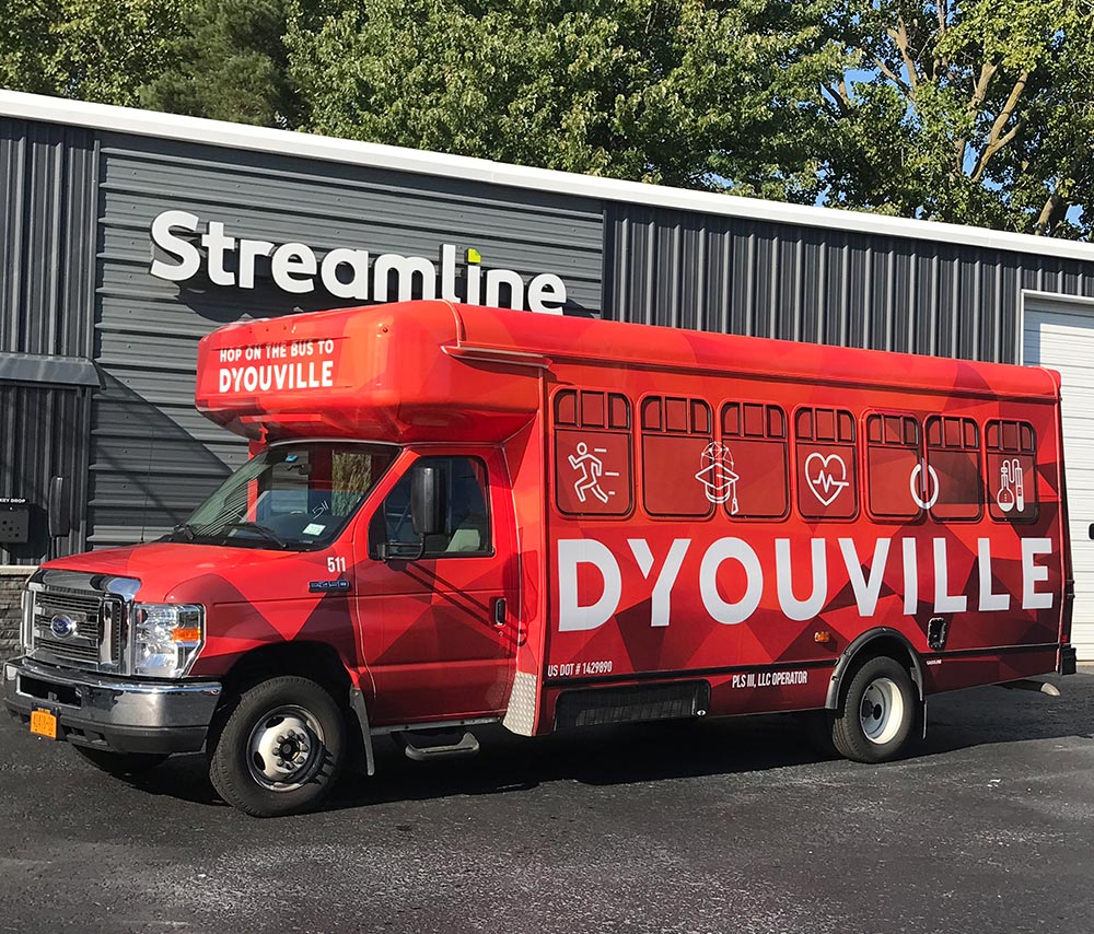 D'Youville College bus wrap